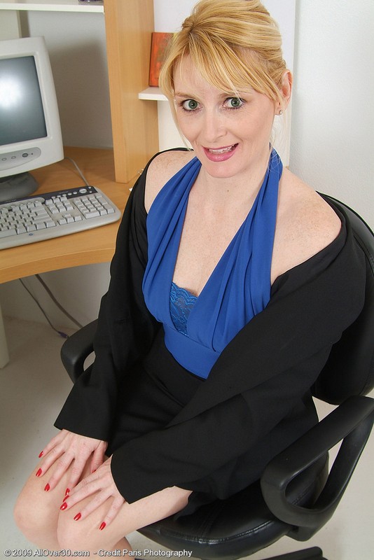 Older blonde secretary showing pink pussy in the office