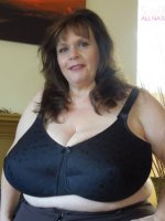 Suzie 44K has soft suckable big tits. They are more swollen than ever and she loves to show them off