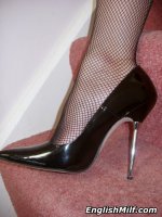 Kinky housewife gets horny on the stairs in pvc and fishnets